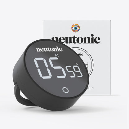 Black digital Focus Timer with large white countdown display and Neutonic branding, nootropics packaging in background. - Neutonic - Focus Timer