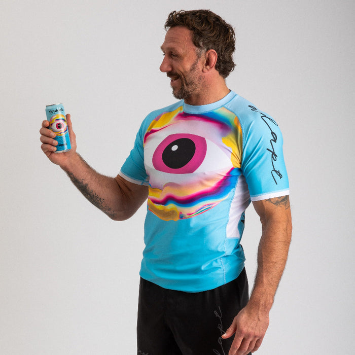 Men’s Neutonic rash vest in bright blue with large pink and white eye graphic and nootropics branding on sleeve. - Neutonic - Neutonic Rash Vest - Men