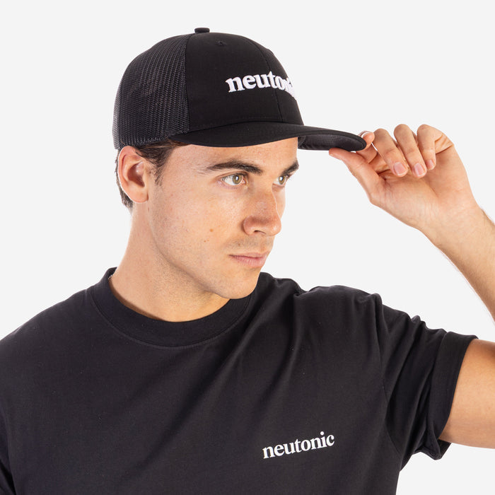 Black trucker cap with white "neutonic" logo, worn with matching black nootropics shirt. - Neutonic - Trucker Cap